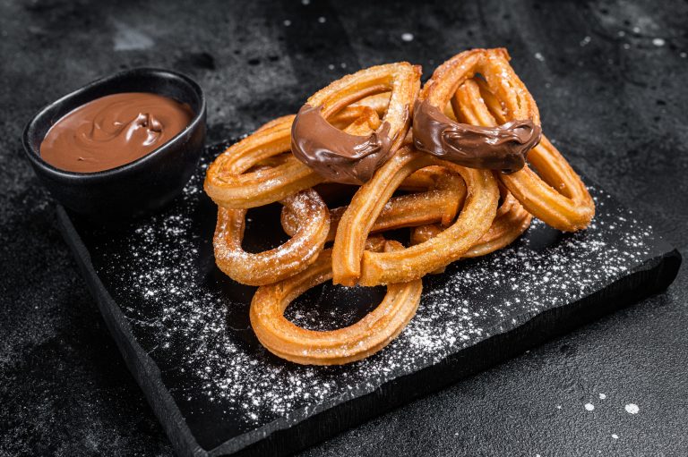 Traditional,Mexican,Dessert,Churros,With,Chocolate,Sause.,Black,Background.,Top