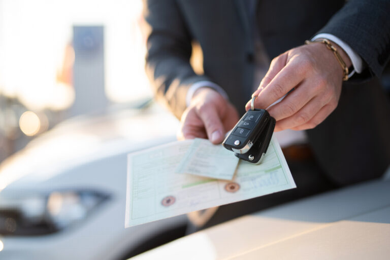 Close-up,Of,Vehicle,Papers,And,Car,Keys,,Car,Purchase