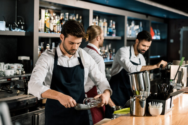 Handsome,Barman,In,Apron,Putting,Ice,In,Glass,With,Ice