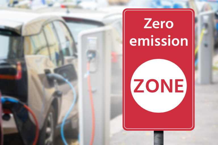 Road,Sign,"zero,Emission,Zone",On,A,Background,Of,Electric